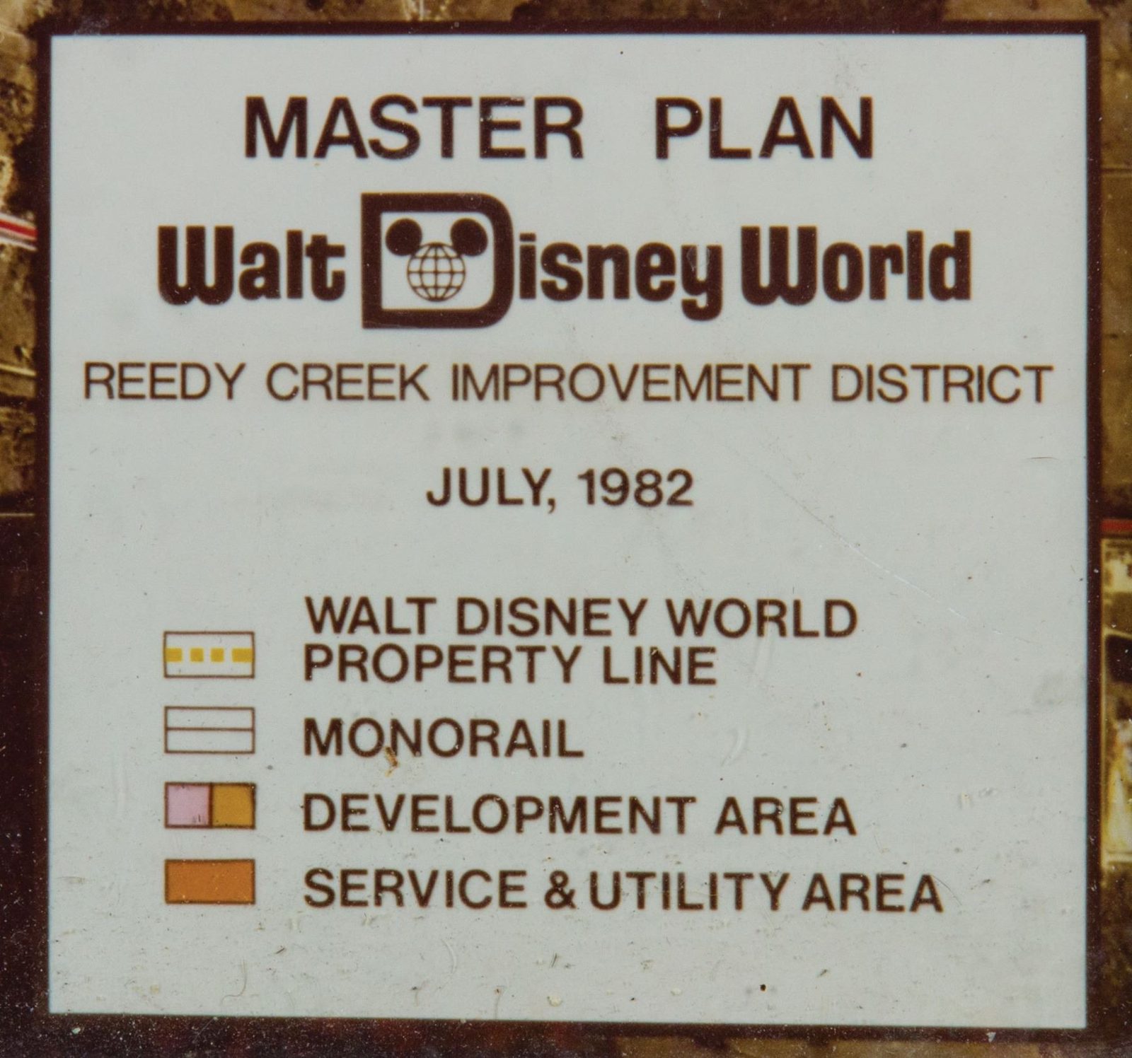 The legend card of the same plan, at readable size: 'MASTER PLAN / Walt Disney World / REEDY CREEK IMPROVEMENT DISTRICT / JULY, 1982', keyed to WALT DISNEY WORLD PROPERTY LINE, MONORAIL, DEVELOPMENT AREA and SERVICE & UTILITY AREA.